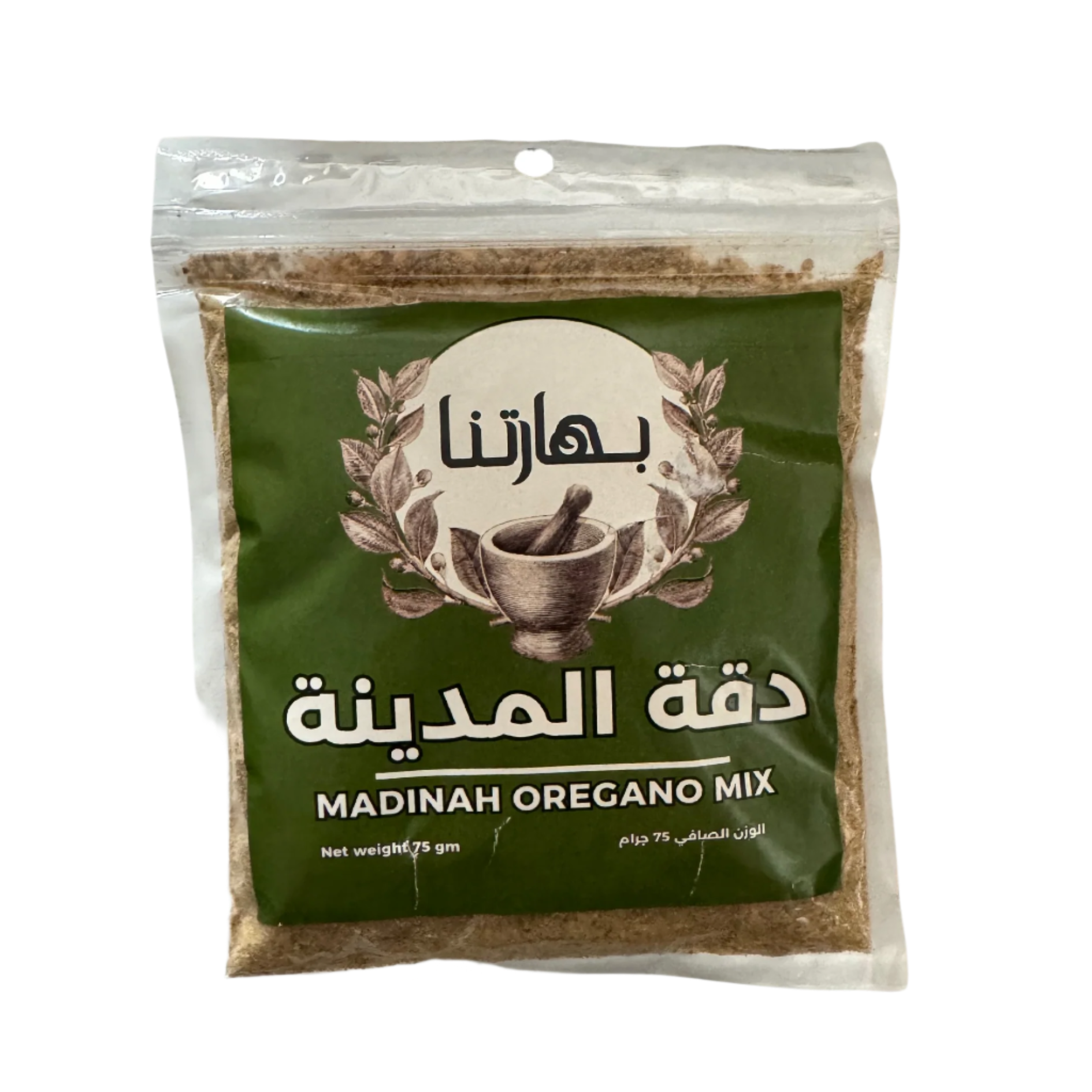 Packaging of Dakah Al-Madina, which is a Madinah Oregano Mix. The package is green with an illustration of a bowl and leaves, indicating it is a food product.